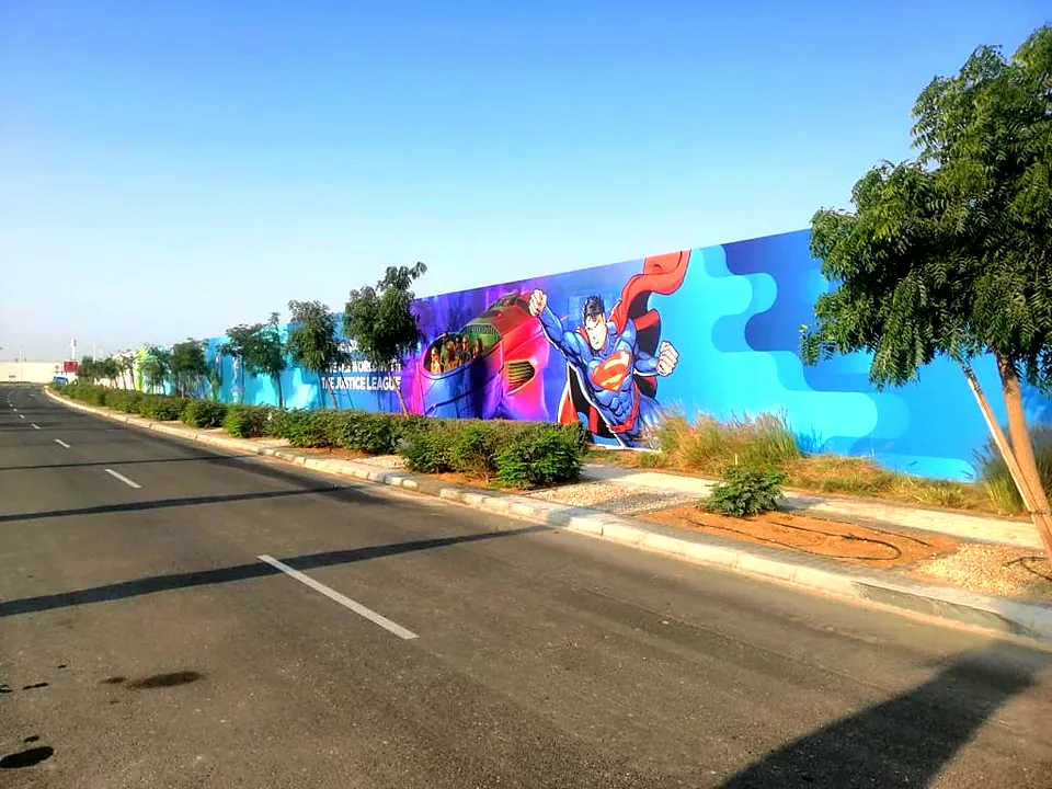 Large format hoarding graphics along a Yas Island road, printed and installed by Thrive Advertising