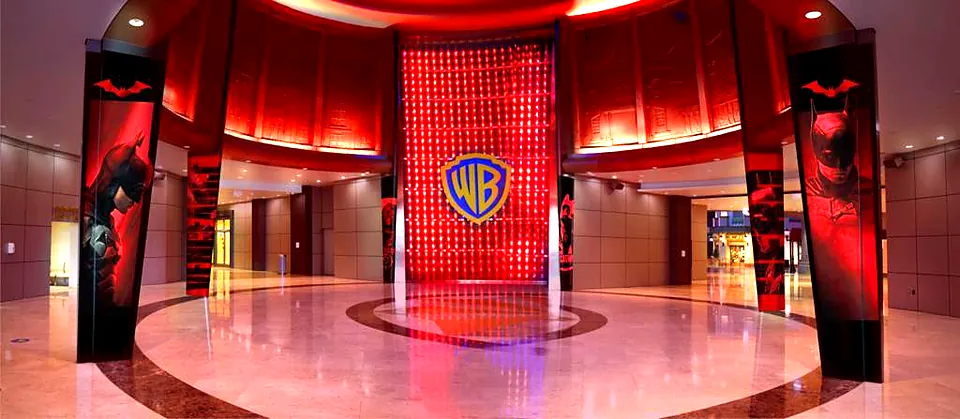 Red themed lobby with feature wall and hanging banners in Abu Dhabi