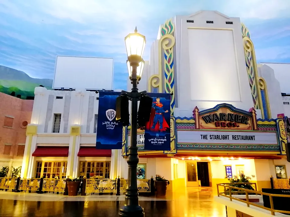 Themed restaurant facade with hanging banners at Warner Bros. World Abu Dhabi