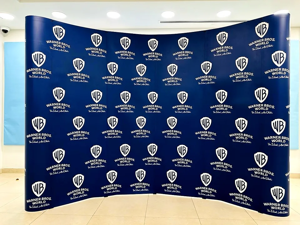 Curved step and repeat media backdrop for Warner Bros. World Abu Dhabi